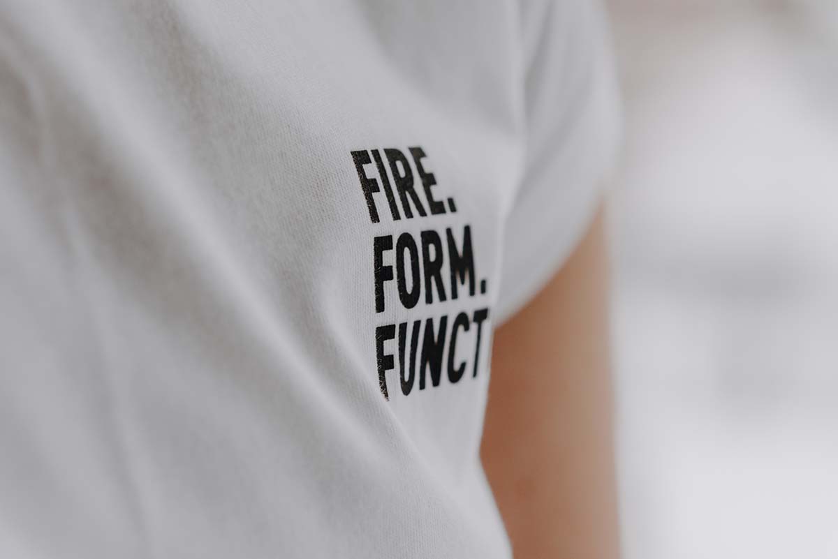 SHIRT Women white S a woman wearing a white t shirt with the words fire, fun.