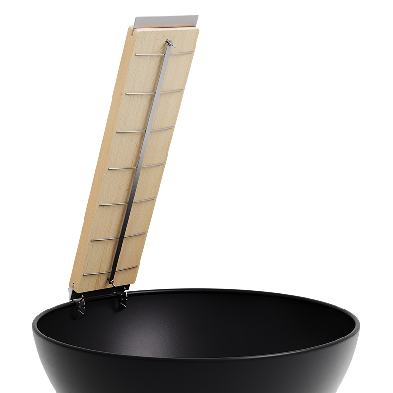 Flame-grilled salmon board A view of a black bowl with a wooden handle and a metal handle, with the Flame-grilled salmon board.