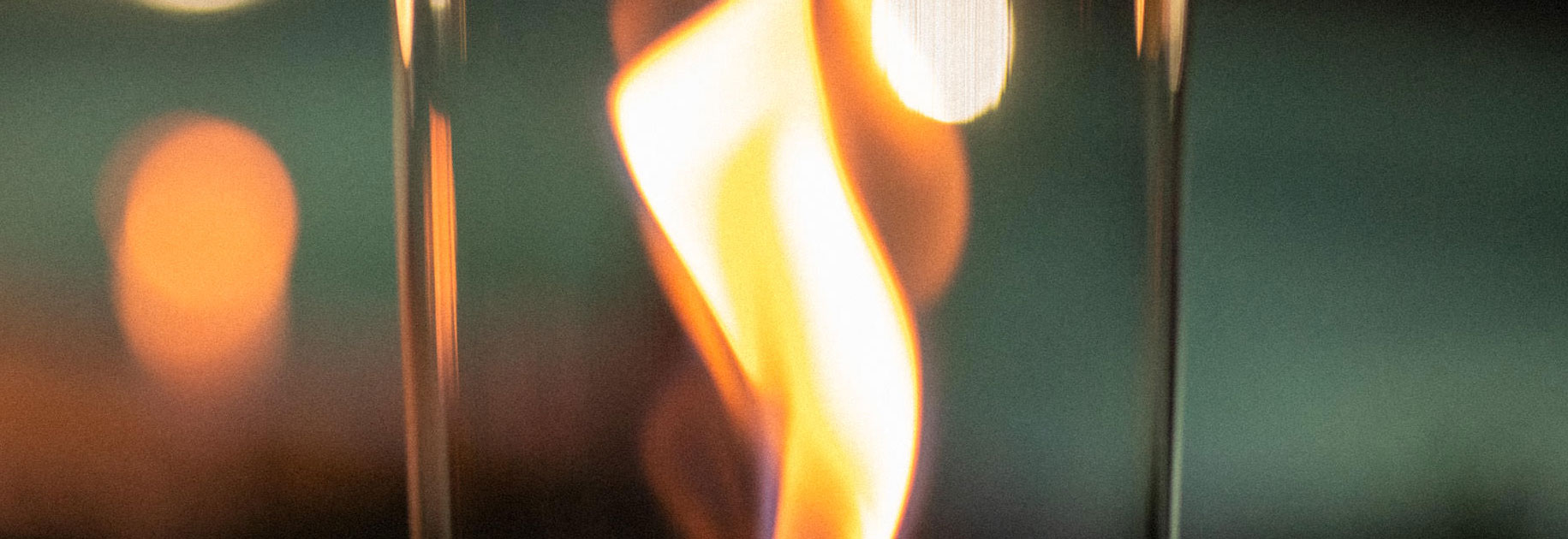 a close up of a glass with a fire in it