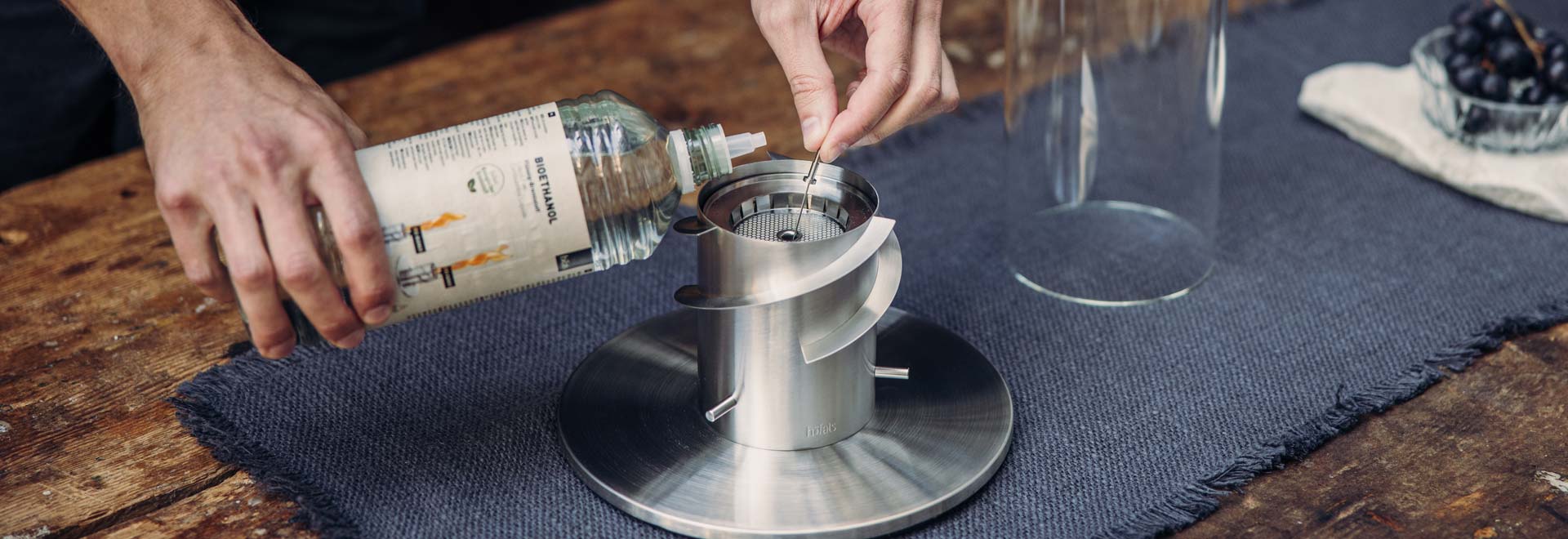 a person pouring bioethanol into BioBurner