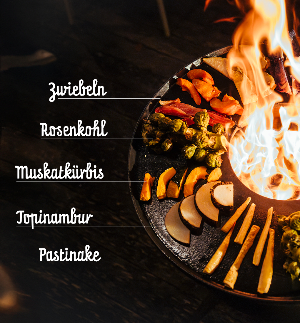 Ein Feuer mit einer Vielzahl verschiedener Arten von Lebensmitteln, das ein stilvolles und zugängliches Bild erzeugt.