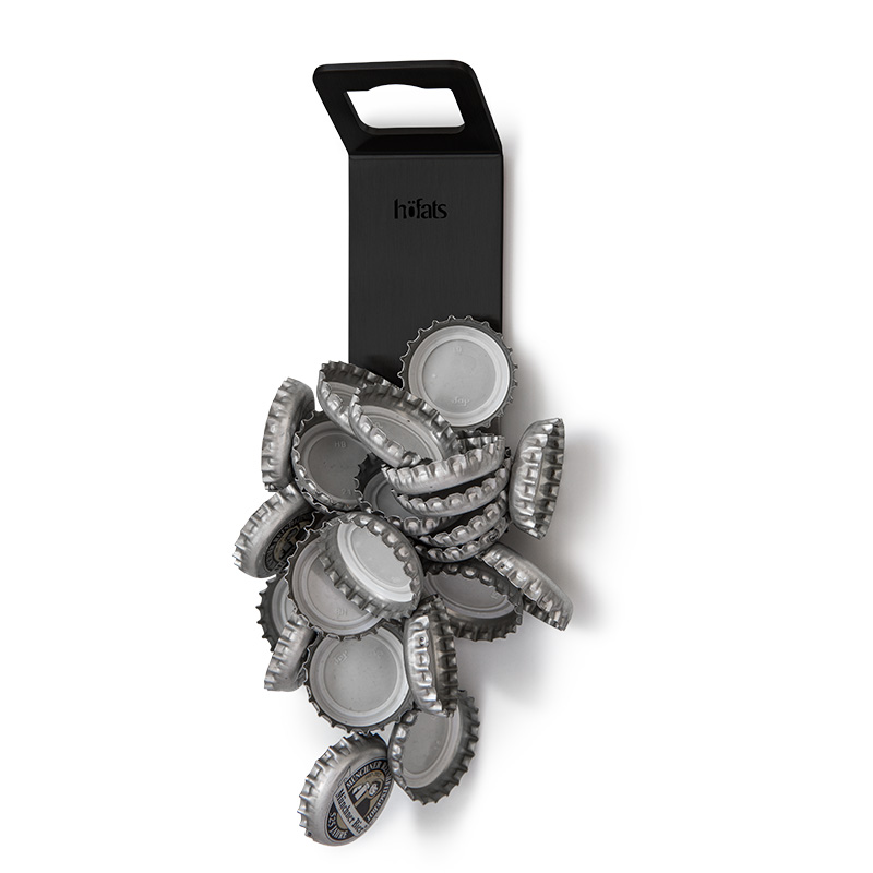 JOHNNY CATCH Magnet Bottle Opener black The 00841 Johnny Catch Magnet Black Bottleopener is shown as a bottle opener with bottle caps sticking to it, creating a stylish and accessible visual.