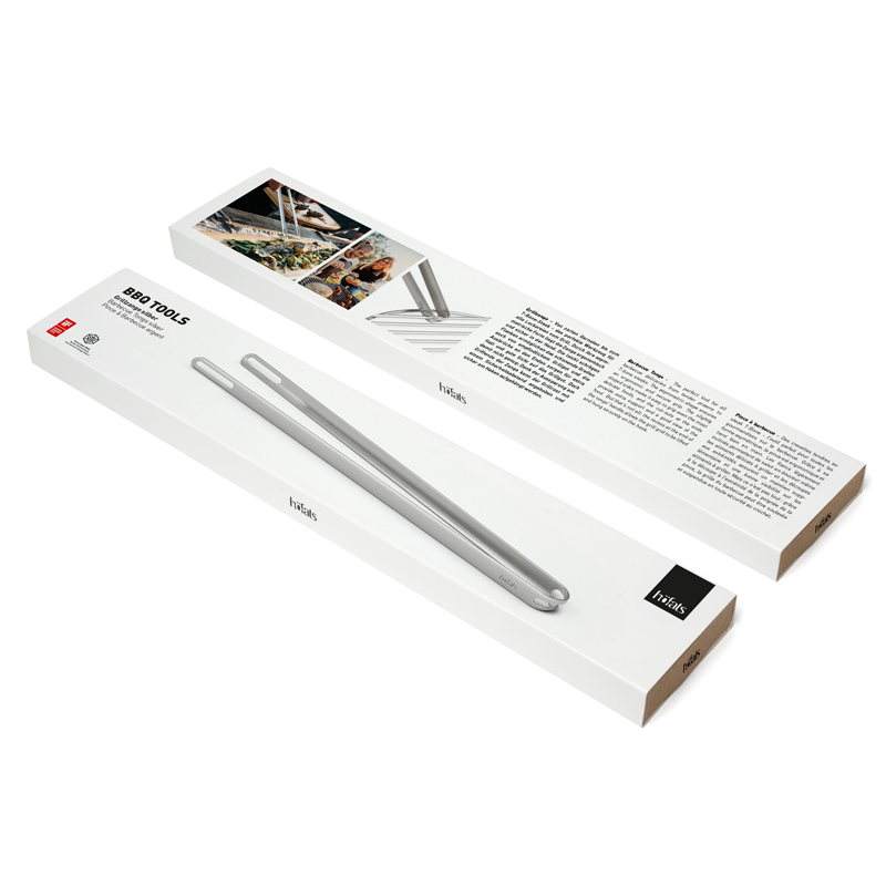 Grillzange Eine einladende Szene betont die Verpackung der Grillzange und fügt sich mühelos in ihre Umgebung ein.