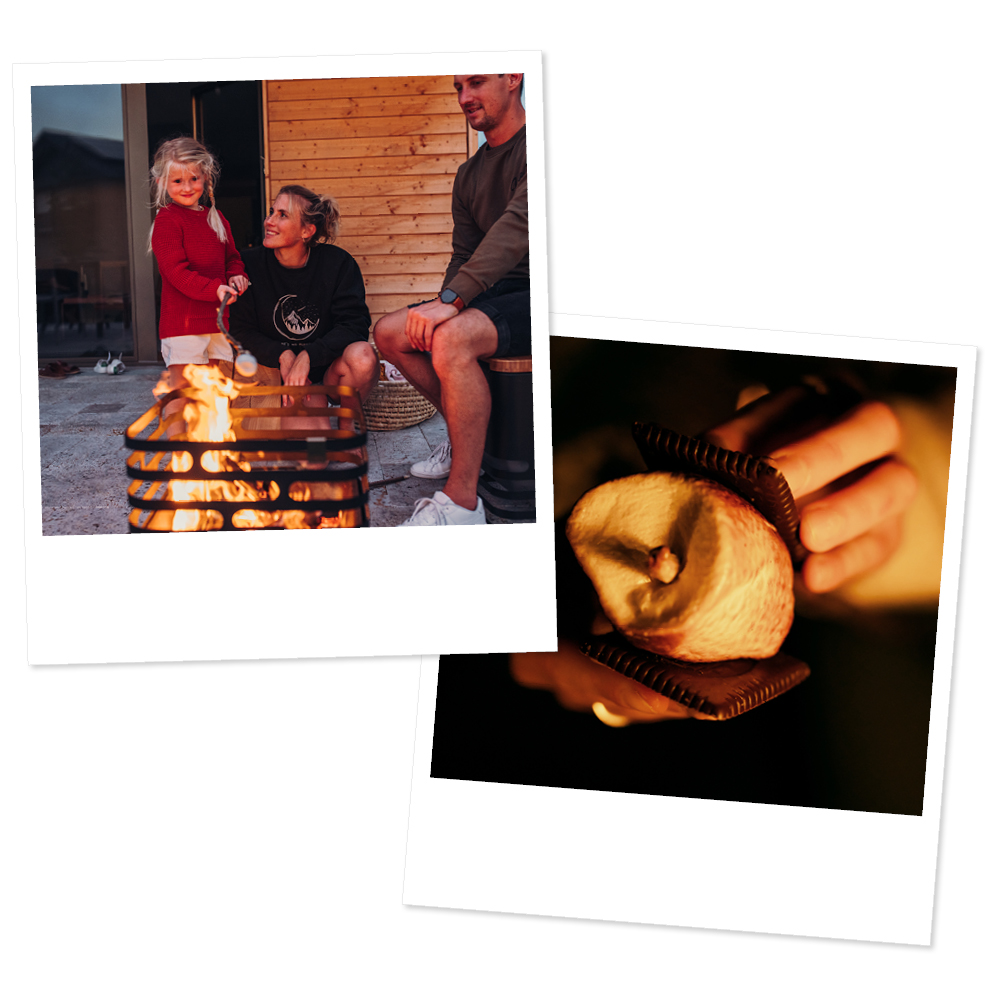 A depiction of a couple sitting around a fire pit