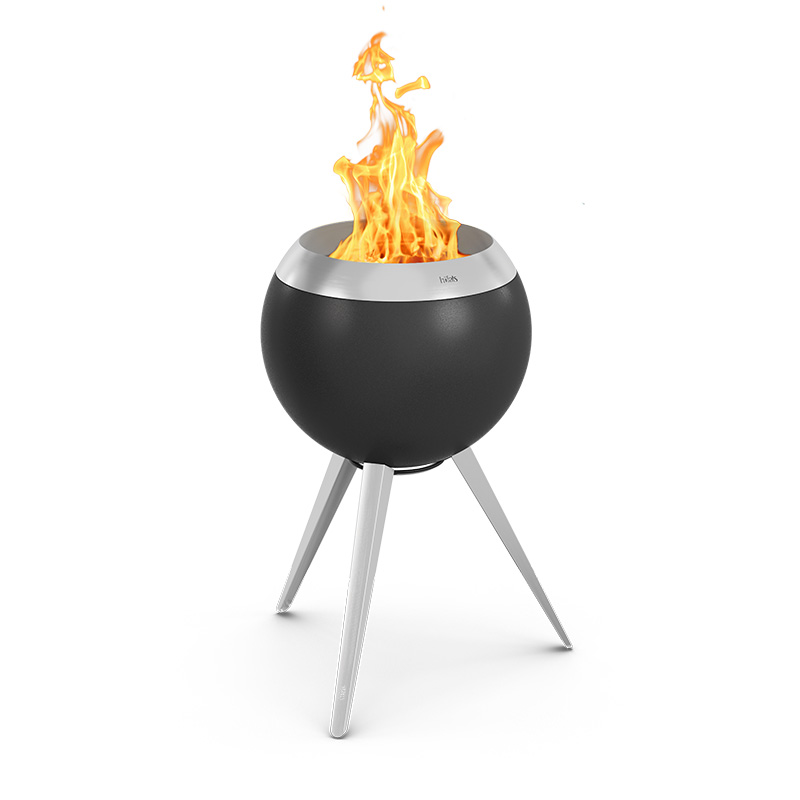 A black fire pit with a flame on top, with the 00963 Moon 45 Plancha BBQ Set high adding a functional and elegant touch to the scene.