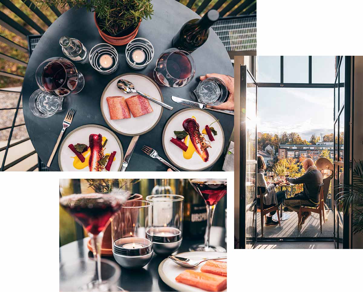 Ein Tisch mit Tellern und Gläsern Wein