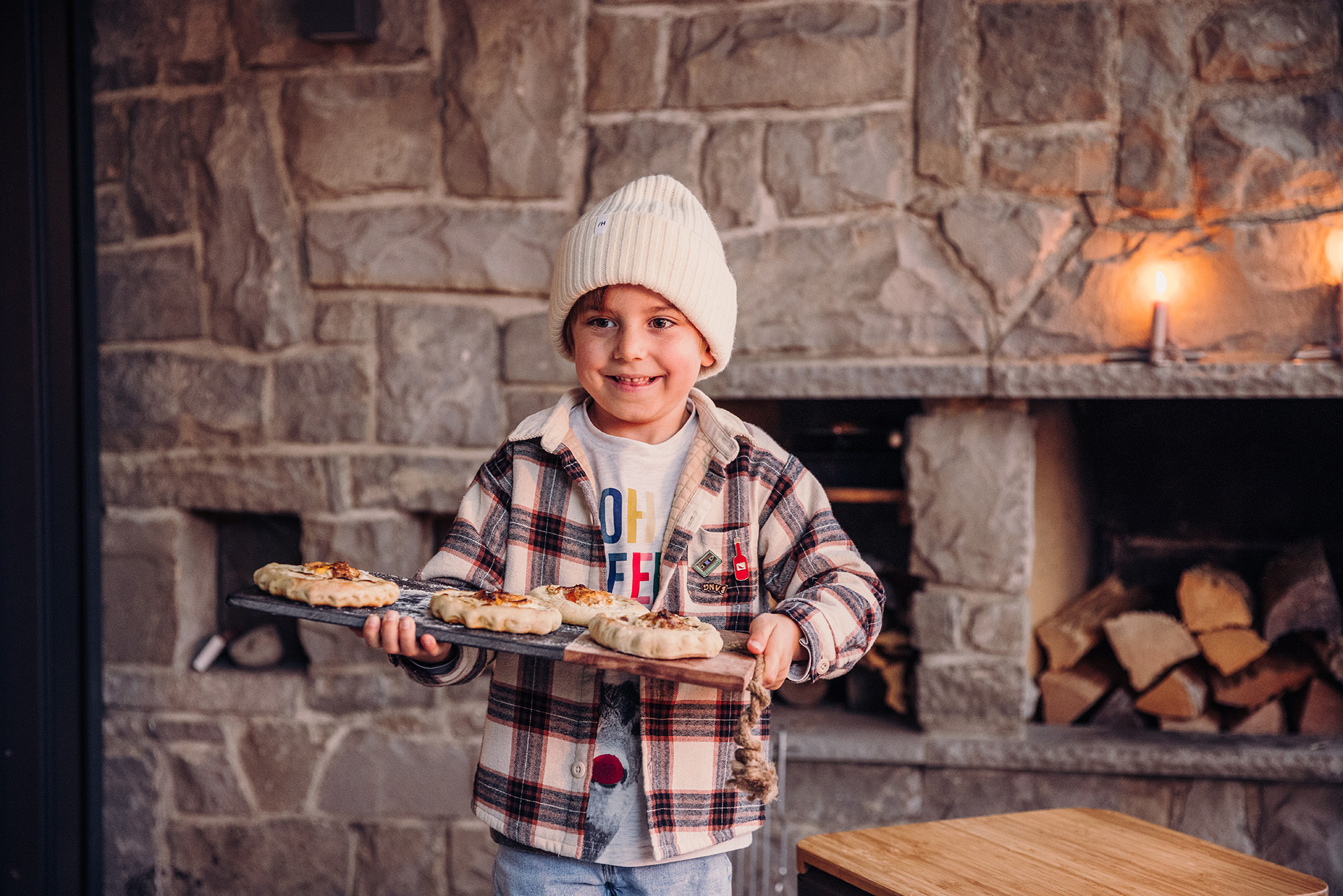 A little boy holding a tray of food