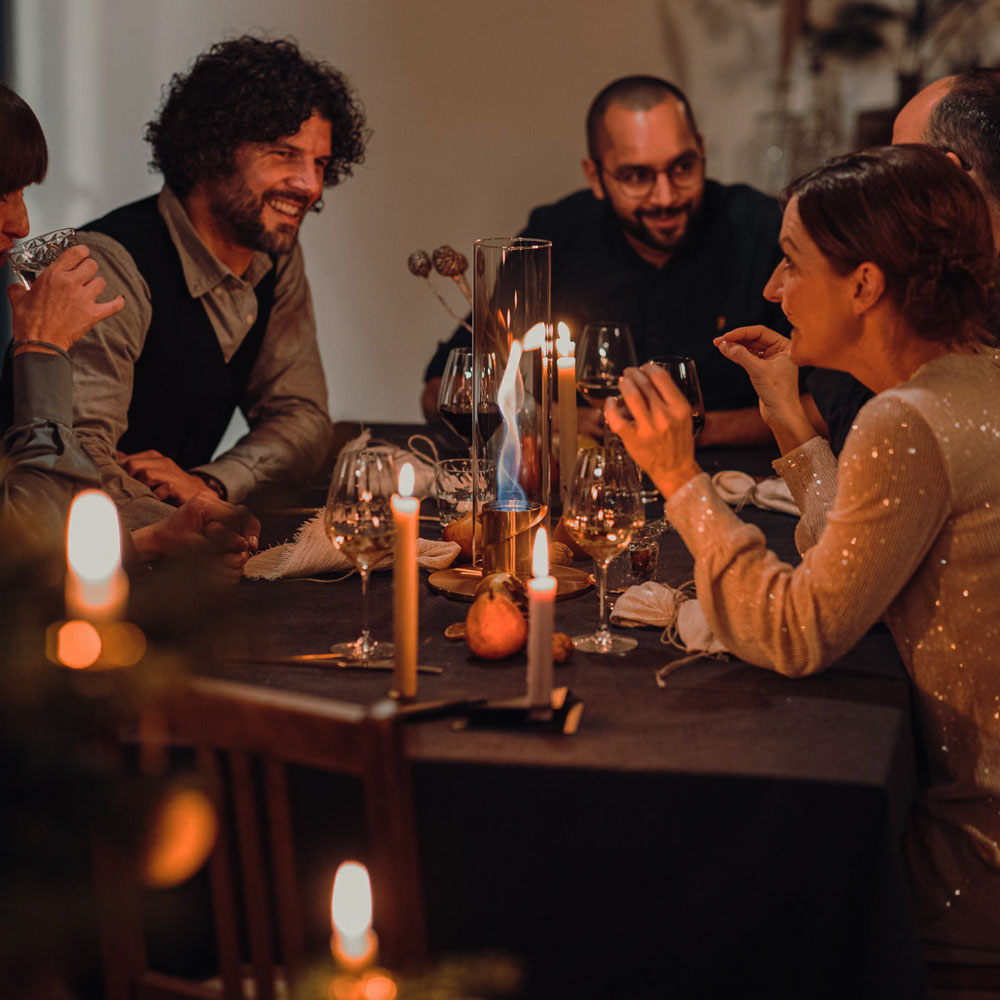 a group of people sitting around a table