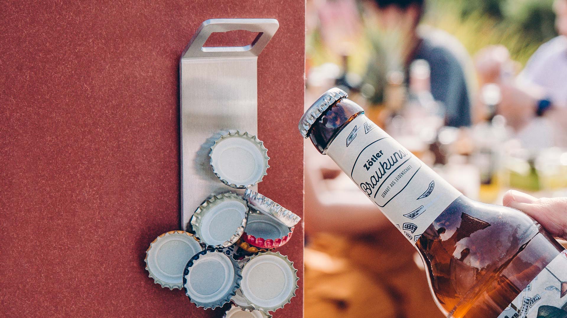 Illustrated is a bottle opener with a bottle of beer, with the JOHNNY CATCH Magnet.