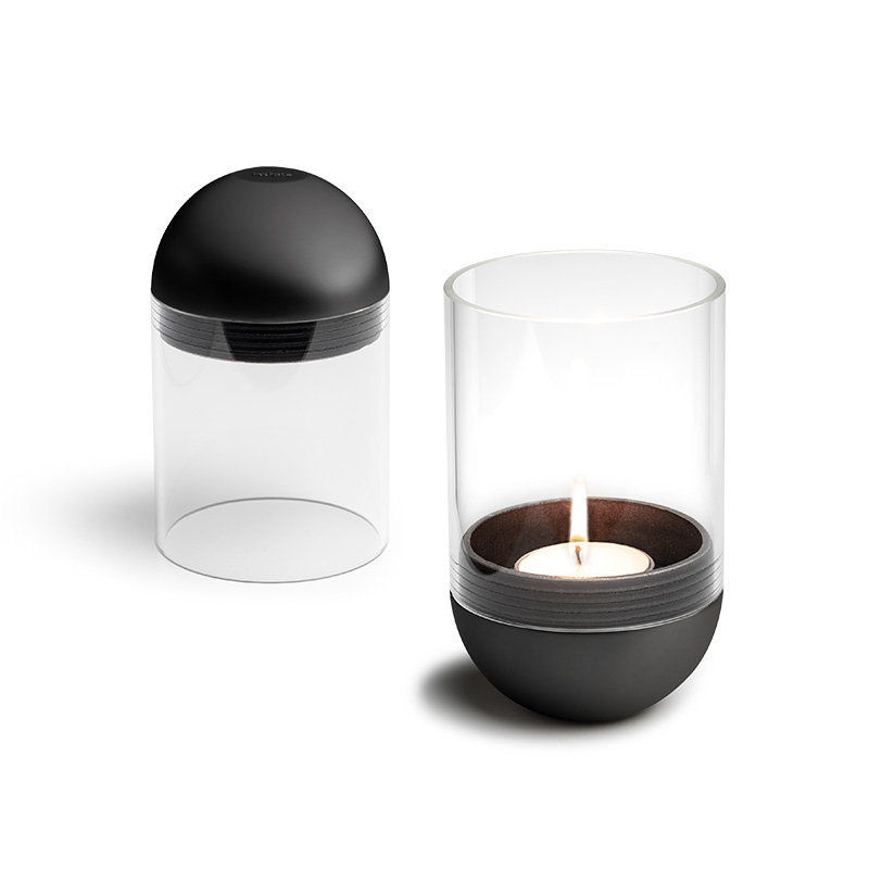 GRAVITY CANDLE Lantern black A view of a candle and a glass container, with the GRAVITY CANDLE Lantern black.