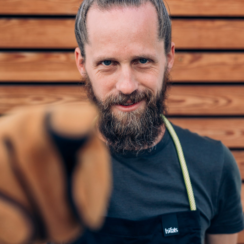 a man with a beard and a dog.
