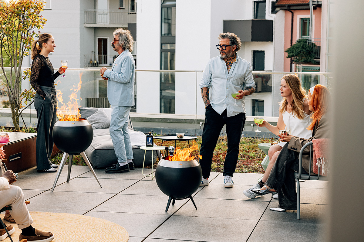 An inviting scene with a group of people sitting around a fire pit, highlighted by the presence of the 00716 Moon 45 with low stand