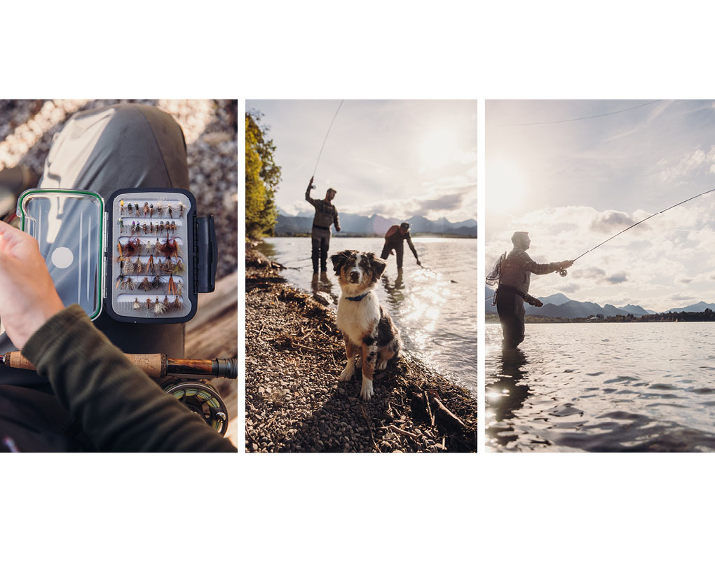 An image showing a man fishing with his dog and a man holding a fishing rod