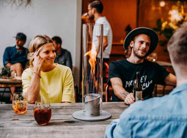 people sitting at a table in a restaurant