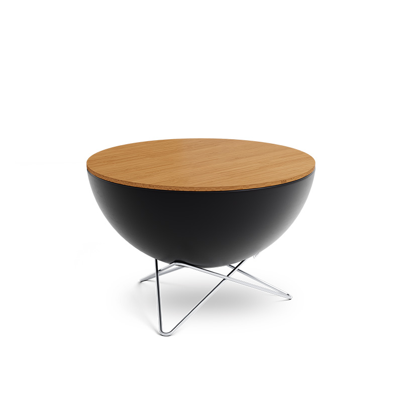 BOWL 70 Auflagebrett Das Foto zeigt einen schwarzen Holztisch mit Metallgestell, auf dem das BOWL 70 Brett liegt.