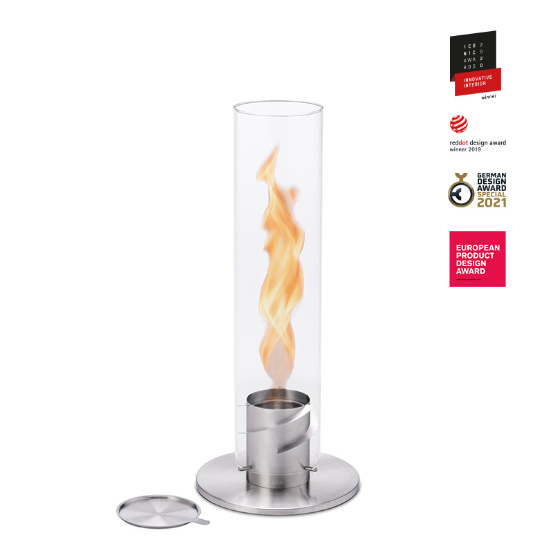 SPIN 120 Tabletop Fireplace silver The photo presents a glass flame with a metal stand, with the SPIN 120 Table Fire silver.