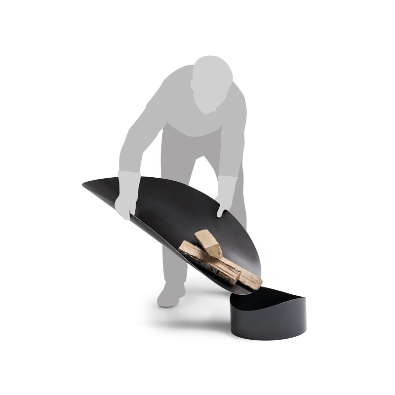 ELLIPSE Fire Bowl This image shows a man is standing on a black object, with the ELLIPSE Fire Bowl.