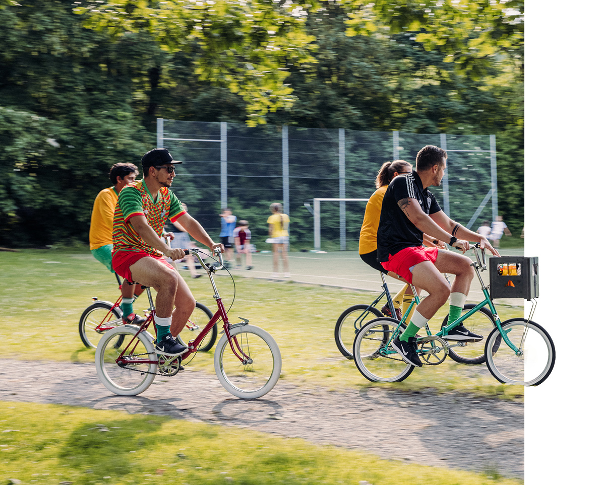 An image showing two people riding bikes on a path