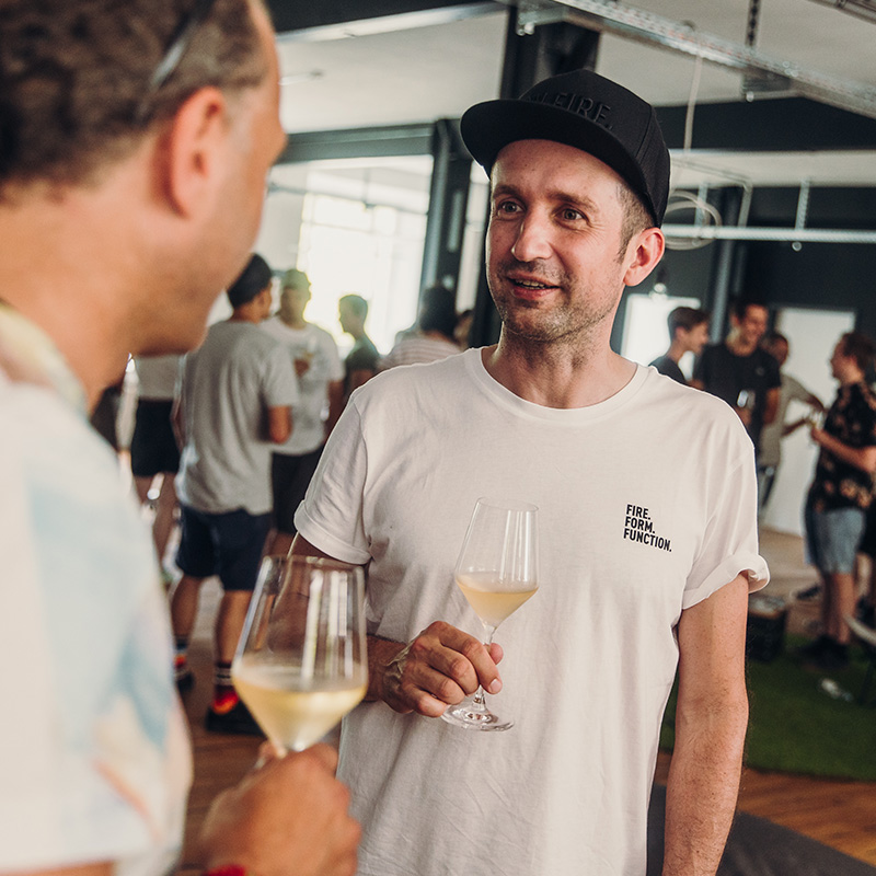 This image shows a man holding a glass of wine, with the SHIRT (Matrix - Parent).