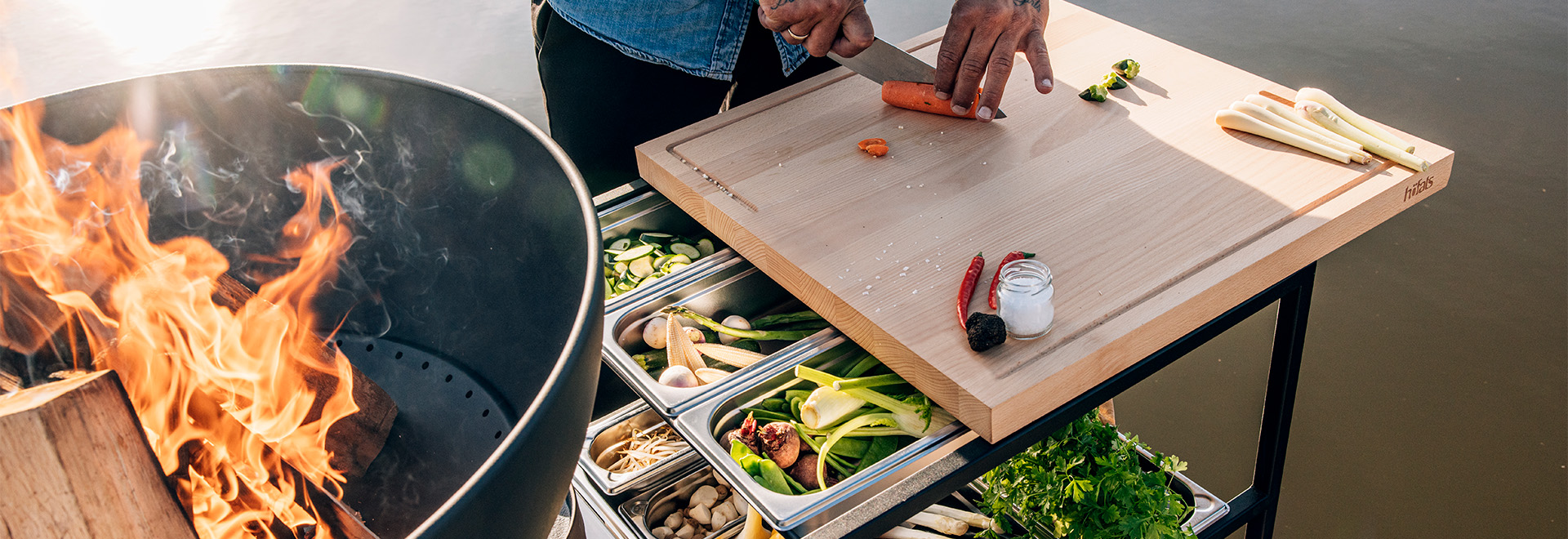 Illustrated is a person cooking food on a grill