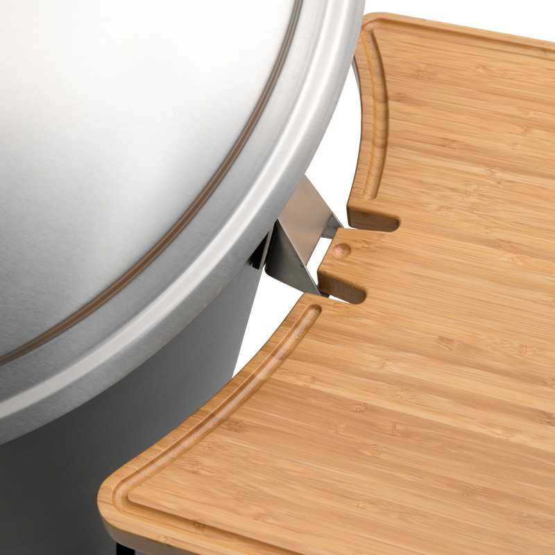 CONE Board This image shows a wooden cutting board sitting on top of a stove, with the CONE Board.