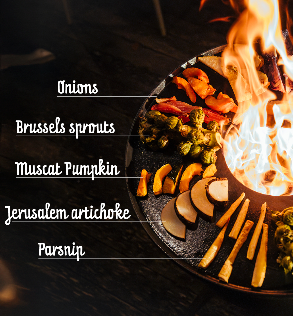 a fire with a variety of different types of food, creating a stylish and accessible visual.