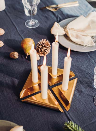 Depicted here is a table with candles and plates on it, with the SQUARE CANDLE (Matrix - Parent).