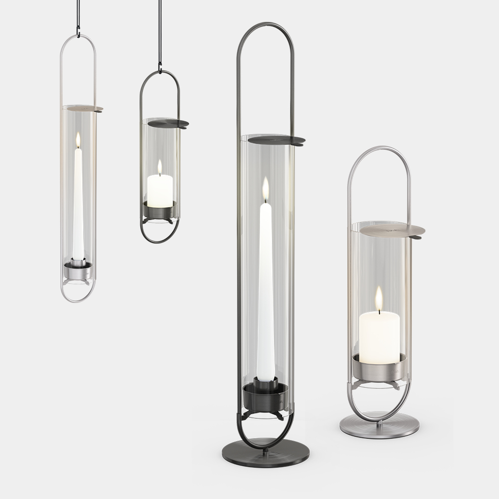 Four glass lanterns with a candle and a candle holder, showing the oval candle