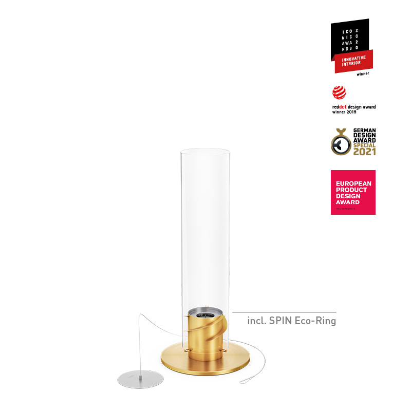 SPIN 900 Tischfeuer gold Das Foto zeigt den gold-weißen Glaszylinder mit goldener Basis, zusammen mit dem SPIN 900 Tischkamin in Gold.