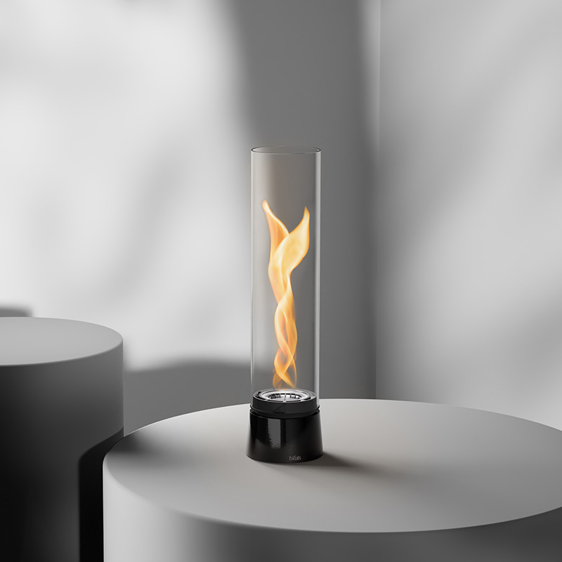 SPIN air 900 Tabletop Fireplace enamel black An inviting scene with a fire is lit on a table, highlighted by the presence of the 00776 Spin Air 900 Tablefire Emaille black