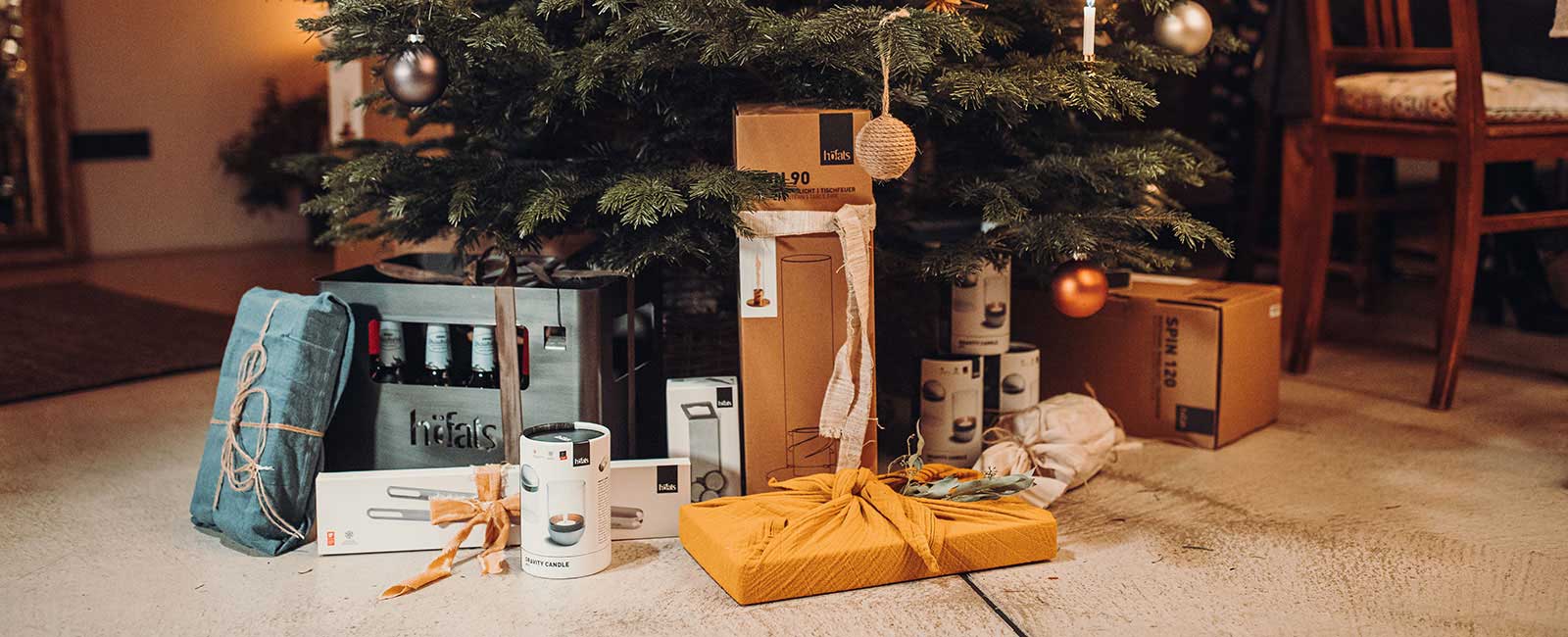 The best Christmas gift ideas A christmas tree with presents on the floor